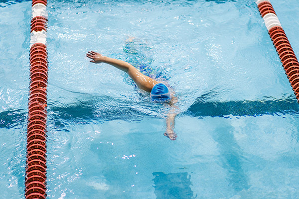 Swimmer swimming in lap lane